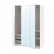White PAX wardrobe with mirrored doors, open displaying shelves and drawers.