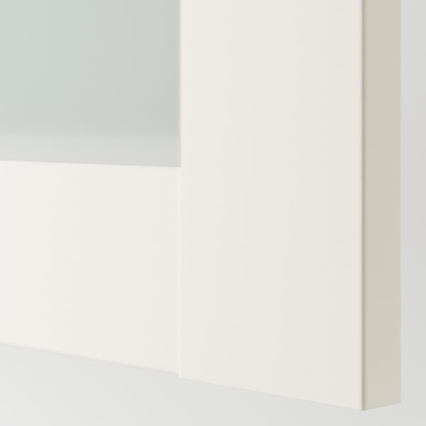 This image displays a white PAX wardrobe section with a glass door, showcasing high-quality finish and sleek design.