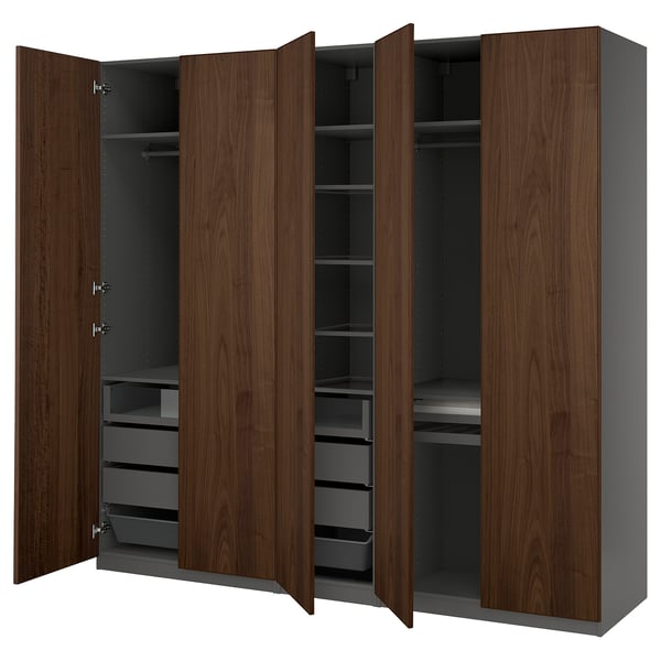 An open brown ikea PAX wardrobe with shelves and drawers.