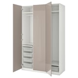 An open ikea PAX closet, featuring pink and white colors, with multiple storage compartments.