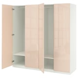 An open peach-colored ikea PAX wardrobe with adjustable shelves.