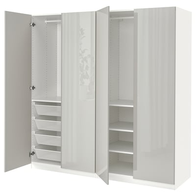 White PAX wardrobe with mirrored doors, mesh basket, adjustable shelves.
