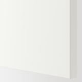 A sleek, modern white wardrobe with a smooth, high-quality finish, featuring soft-closing hinges and organized compartments.