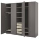 A gray IKEA PAX wardrobe with open doors, displaying shelves and drawers.
