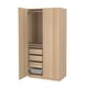Option: An open PAX wardrobe in light oak. It three drawers, a mesh basket, and a hanging rod. The design is modern and functional.