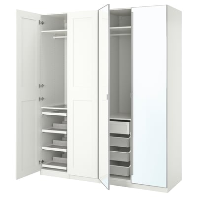 A white IKEA PAX wardrobe with open sections revealing shelves, drawers, and hanging space.