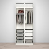 A PAX wardrobe with drawers, hanging space, and mesh baskets for organized clothing storage.