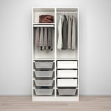 This image shows a compact PAX wardrobe with mesh baskets for airy storage, drawers for smaller items, and hanging space for clothes.