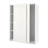 A white PAX wardrobe with sliding doors and internal shelves. It is modern and minimalist.