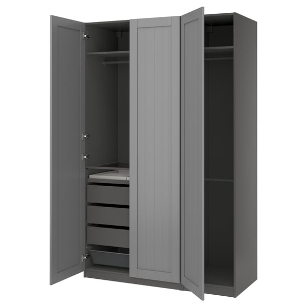A grey PAX wardrobe with open doors, revealing drawers and shelves inside.