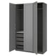 A grey PAX wardrobe with open doors, revealing drawers and shelves inside.