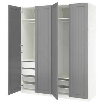 Grey PAX wardrobe, open showing shelves, drawers, and mesh baskets.