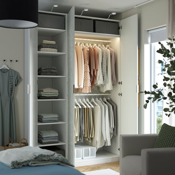 Modern wardrobe with shelves and hanging garments