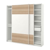 A white PAX wardrobe with light wood panels and sliding doors. It shelves and hanging space for clothes.