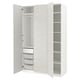 A white PAX wardrobe with mesh baskets and adjustable shelves.