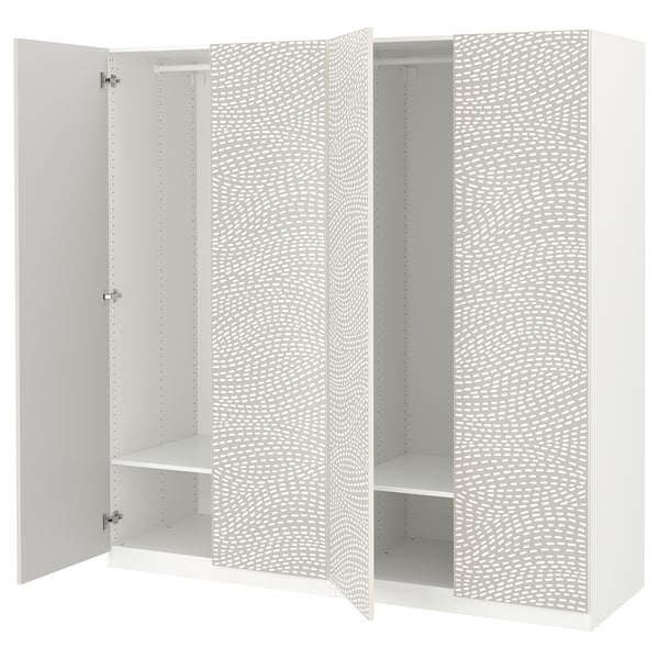 White PAX wardrobe with wavy pattern, three sections, open doors revealing shelves, and soft-close hinges.