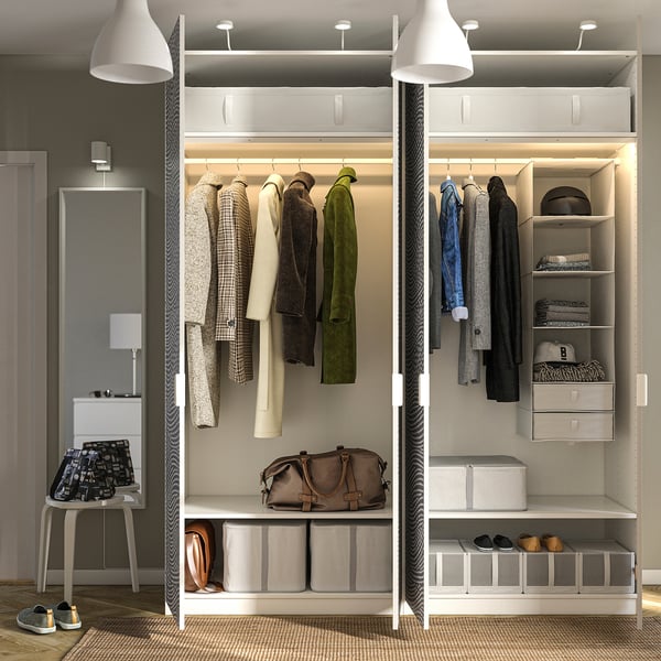 Modern closet with coats, shelves, and ramped lighting; needs wall fixing.