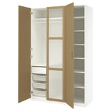 Open white PAX wardrobe with oak doors, showing shelves and storage.