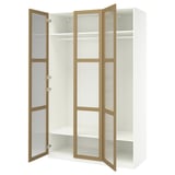 This image a white PAX wardrobe with light brown textured glass doors and silver hinges. It has multiple shelves and a hanging rod inside.