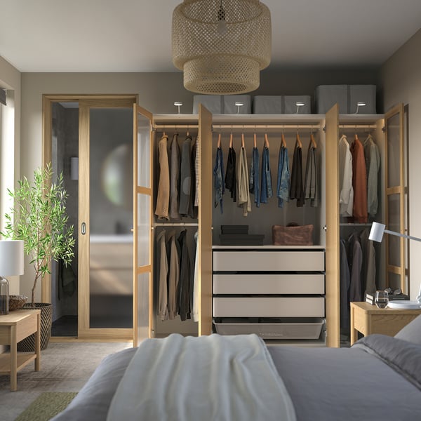 Modern mirrored wardrobe with led lights, clothes storage & adjustable feet. Ikea PAX series.