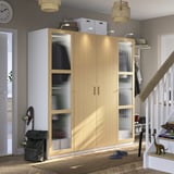 Wooden PAX wardrobe with glass doors, toys on white stairs, led-lit shelves.