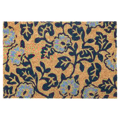 A blue-patterned PLATSMÄRKE doormat with a floral design. Made from coconut fiber, its durable and eco-friendly.