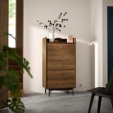 Mid-century modern chest: RÅDMANSÖ, walnut, five drawers, black metal legs, minimalist design.