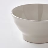 Gray bowl on white surface.