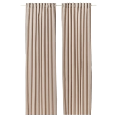 This image two beige SANELA curtains hung side by side, made from 100% cotton velvet, with a simple, elegant pleated design.