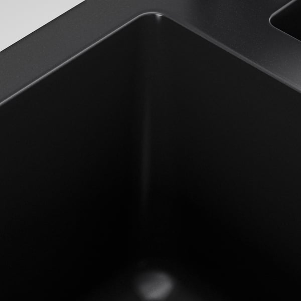 Black kitchen sink with sleek, seamless design and sloping drainboard. High-quality material, tough and stain-resistant.