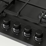 Gas stove with four control knobs, black finish, sturdy cast iron supports.