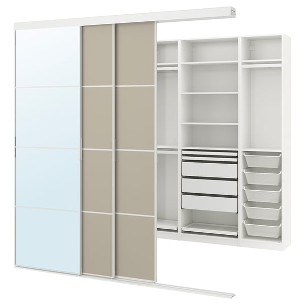 This image shows a white SKYTTA wardrobe with mirror and fabric doors, featuring shelves, drawers, and hanging space.