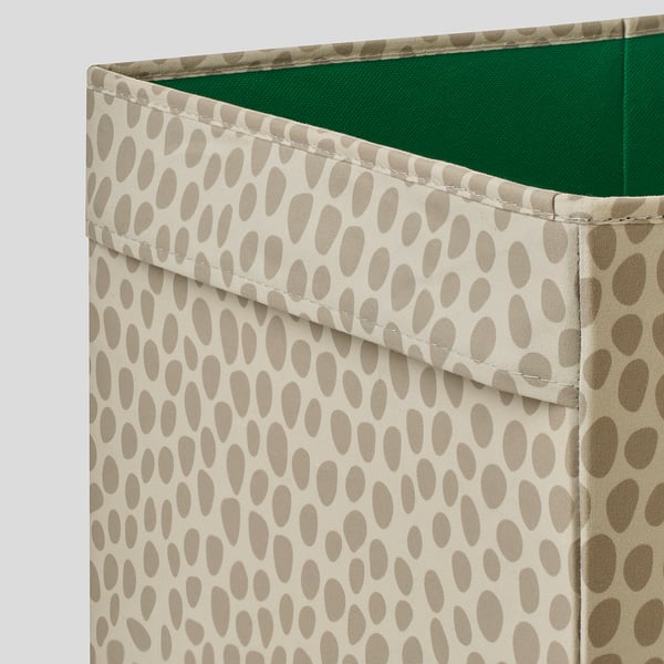 Fabric-covered storage box, beige with brown dots, sturdy, handles for portability.