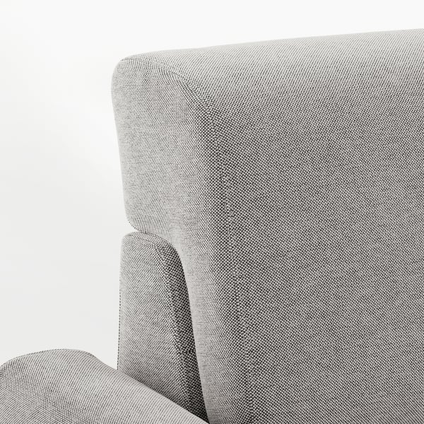 Close-up of modern gray upholstered sofa with curved lines, showcasing high-quality fabric texture.