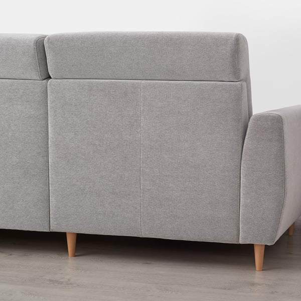 Light grey corner sofa with clean lines, high back, and wooden legs, giving a modern and comfortable look.