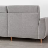 Light grey corner sofa with clean lines, high back, and wooden legs, giving a modern and comfortable look.