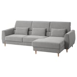 Modern light gray l-shaped sofa with wooden legs, high back, and loose cushions. Comfortable and stylish for relaxation.