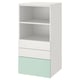A white and light green SMÅSTAD bookcase with three sections: two open shelves at the top and three drawers at the bottom.