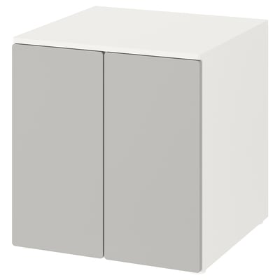 A white, cube-shaped storage cabinet with two doors, named SMÅSTAD, suitable for childrens rooms.
