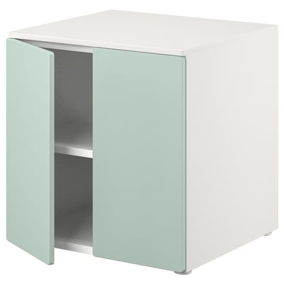 White cube storage unit, light green doors, clean design.