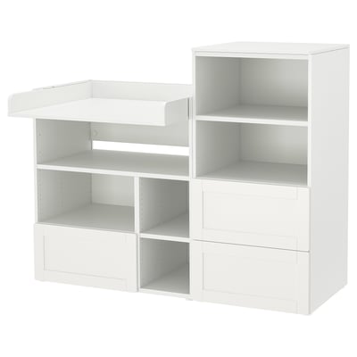 A white ikea SMÅSTAD modular storage unit for a childs room, featuring multiple shelves and drawers for versatile storage.