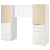 This image an ikea SMÅSTAD white and wood bedroom storage unit with multiple drawers and cabinets.