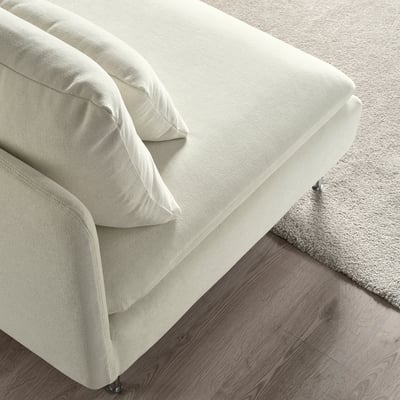Clean, modern sofa with sleek lines, soft cushions, and high legs, suggesting comfort and durability.