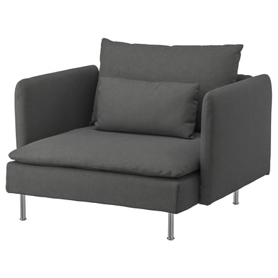 Dark gray modern chair, deep seat, slim legs, stylish, comfortable, soft fabric.
