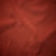 Dark brown, smooth fabric close-up. Fine texture, high-quality appearance.