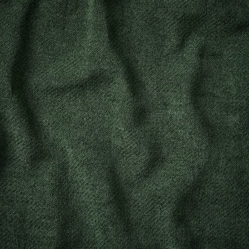 Close-up of luxurious, textured dark green fabric, showcasing its soft, plush quality and subtle sheen.