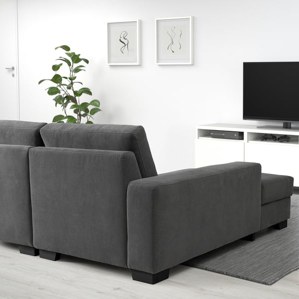 Modern grey SÖRVALLEN sofa with chaise longue in minimalist living room