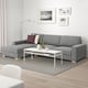 Modern living room with SÖRVALLEN sectional sofa, coffee table, and minimalist decor.