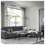 Modern living room with SÖRVALLEN sectional, coffee table, rug, and large window.