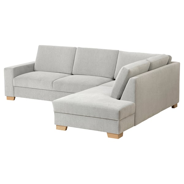 A light gray SÖRVALLEN sectional sofa with a minimalist scandinavian design. It clean lines, a chaise longue, and sturdy wooden legs.